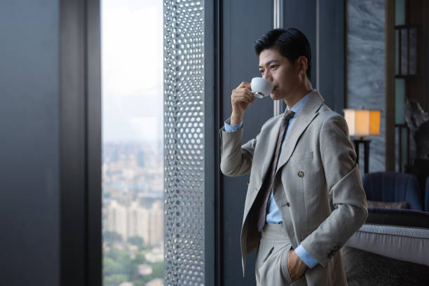 istock Asian business men are drinking coffee 1325927465