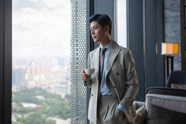istock Asian business men are drinking coffee 1325927481