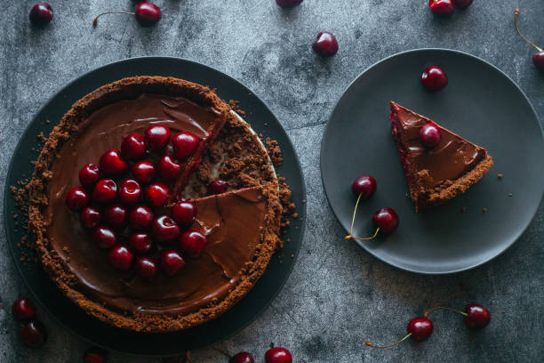 Pie with chocolate and cherries. Delicious cake on a plate