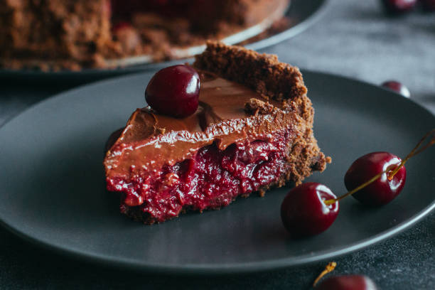 istock Pie with chocolate and cherries. Delicious cake on a plate 1325927736