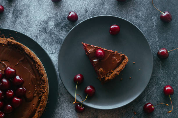 istock Pie with chocolate and cherries. Delicious cake on a plate 1325927794