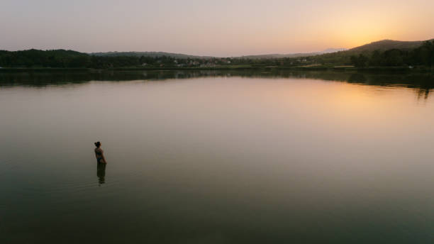 istock Enjoying summer sunset on the lake 1325927822