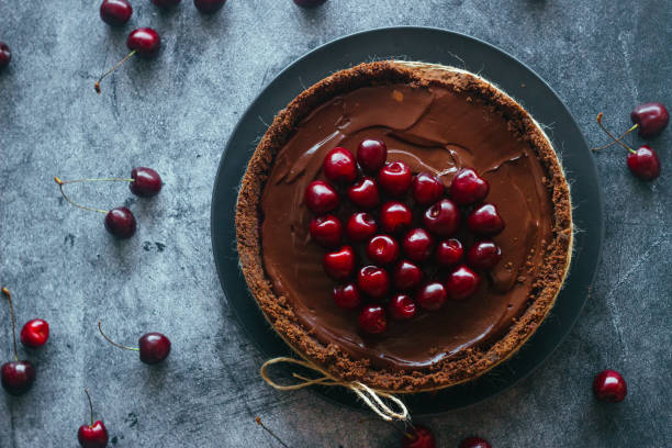 istock Pie with chocolate and cherries. Delicious cake on a plate 1325927831