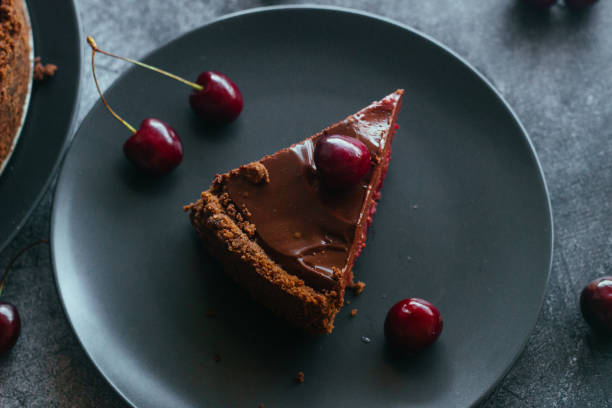istock Pie with chocolate and cherries. Delicious cake on a plate 1325927850