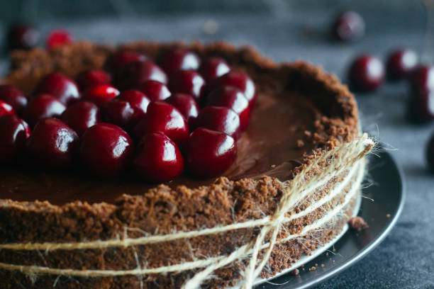 istock Pie with chocolate and cherries. Delicious cake on a plate 1325927865