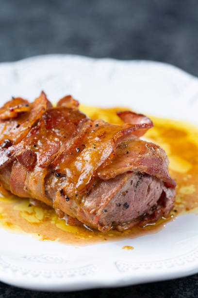 istock bacon wrapped pork tenderloin 1325928736