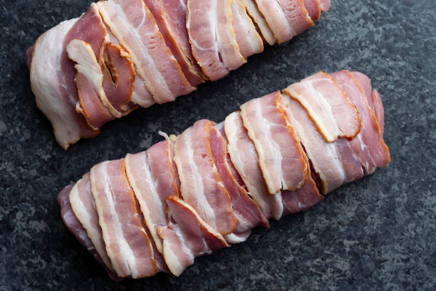 istock bacon wrapped pork tenderloin raw uncooked 1325928746