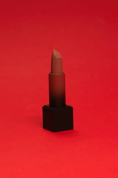 istock Red lipstick on a red background. Makeup. 1325928985
