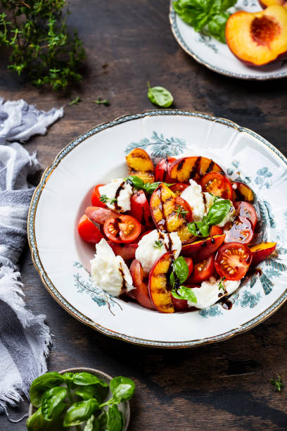 istock Grilled peach salad with mozzarella and tomatoes 1325929082