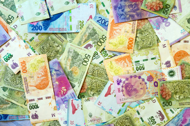 istock Several banknotes of disorderly Argentine pesos seen from above 1325930065