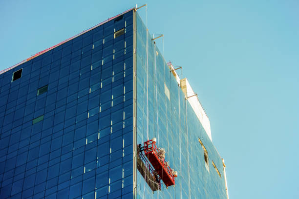 istock Window cleaning scaffold hanging on a building 1325930128