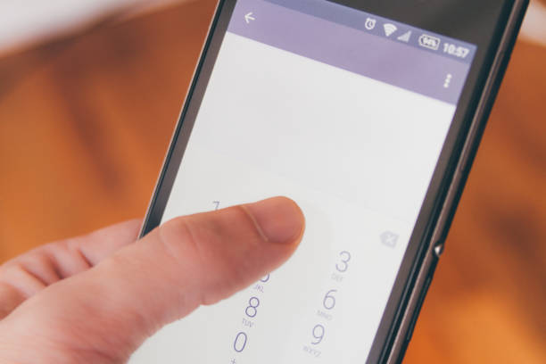 istock Thumb of a man dialing a number on his smartphone 1325931374