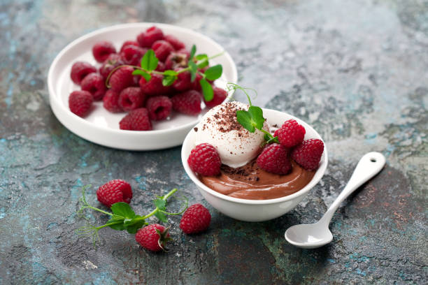 istock Chocolate mousse dessert with vanilla ice cream and fresh raspberries 1325934341