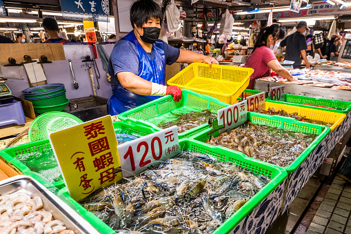 A stall selling seafood at the traditional market in Kaohsiung, Taiwan. This is a large traditional market in North Kaohsiung, Taiwan