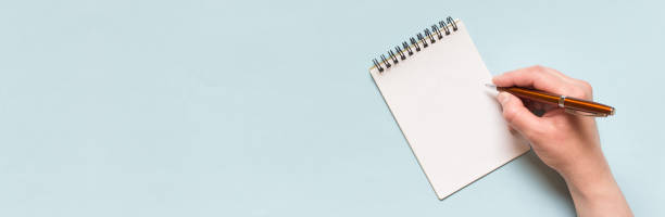 istock Wide banner with copy blank space and hand writting on spiral notebook 1325940110
