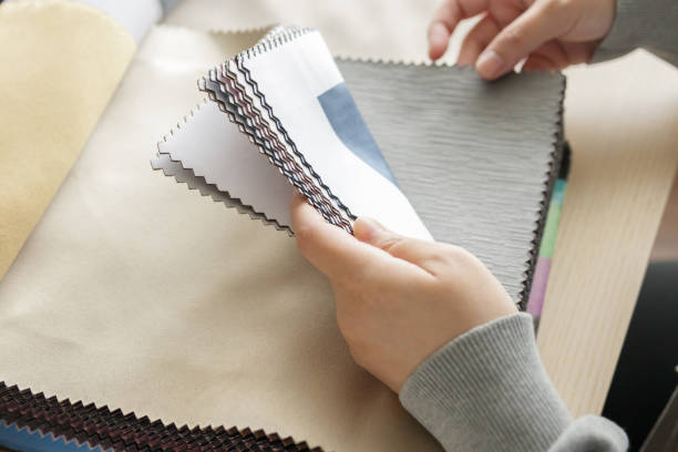 istock female designer with fabric color samples choosing textile for curtains 1325941432
