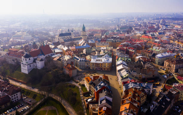 View from drone of historic center of Lublin with Old Church Square and Dominican monastery on background with Catholic Archcathedral and Trinitarian Tower at springtime, Poland