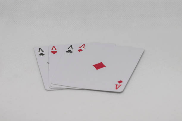 istock Four aces poker cards stacked side by side 1325944885