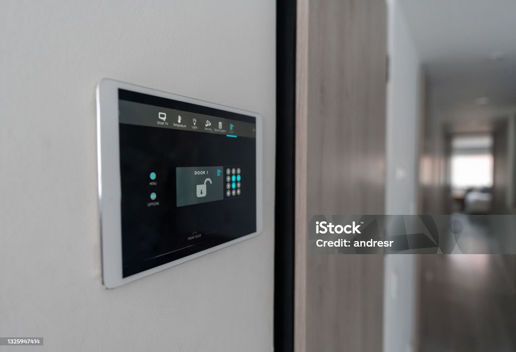 Close-up on an automated security system at a house Close-up on an automated security system at a house locking the front door - smart home concepts Burglar Alarm Stock Photo