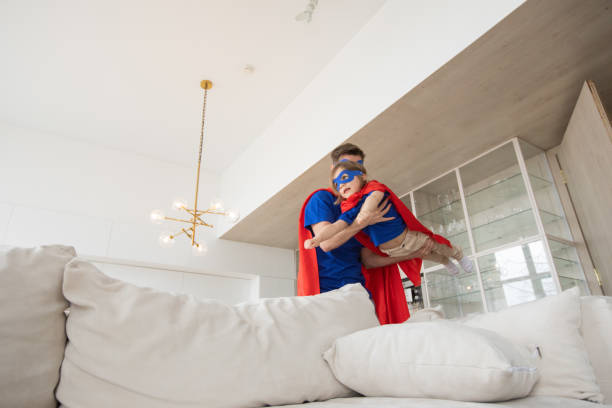 istock Father and son play superhero 1325951508