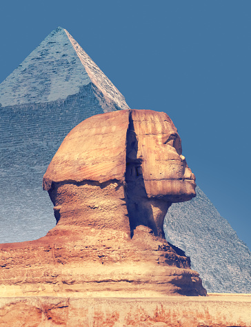 Egyptian Sphinx and Great Pyramid of Khafre (Chephren) in Giza - famous egyptian landmarks in Cairo. Background for travel catalog or design of vertical cover for Egypt tour with place for your text.