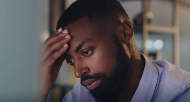 istock Shot of a young businessman looking stressed out while working in an office 1325954117