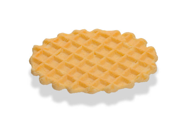 istock Round baked sweet waffle isolated on a white background 1325954875