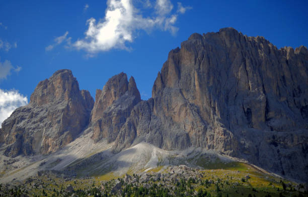 istock Large rocky mountains under a blue sky. 1325959441