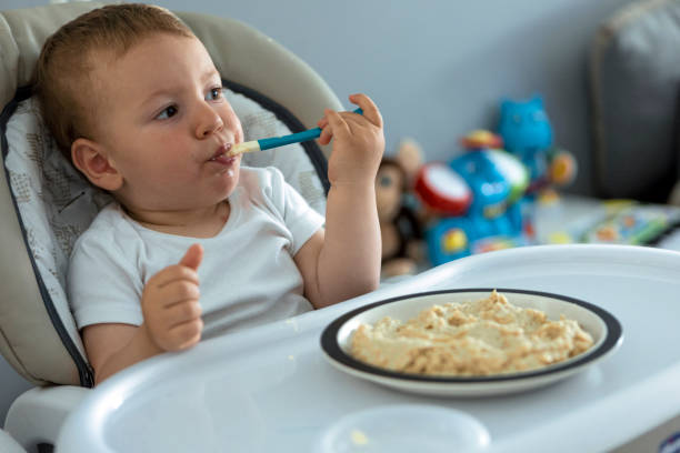 istock Little baby boy are eating 1325959656