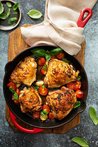istock Chicken thighs roasted with tomatoes and garlic 1325962033