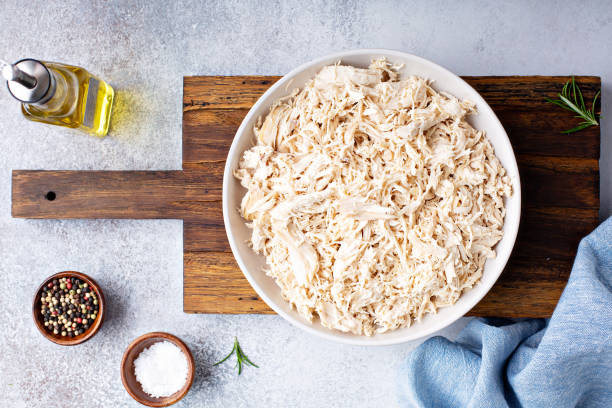 Shredded chicken meat Shredded chicken meat in a big bowl shredded stock pictures, royalty-free photos & images