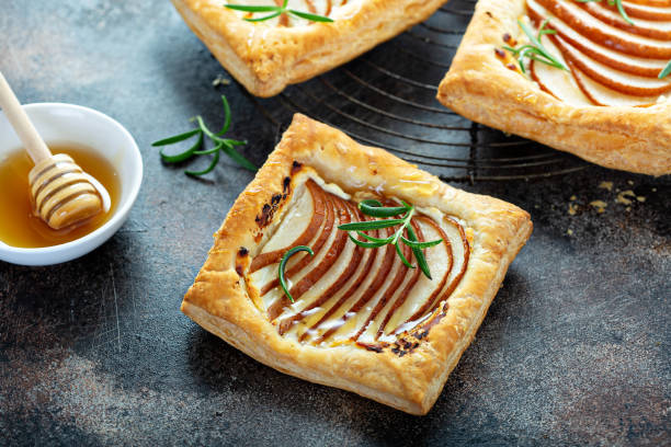 istock Puff pastries with pear, rosemary and honey 1325963154