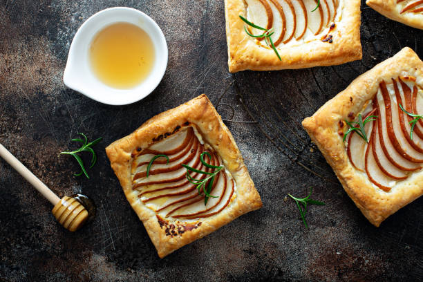 istock Puff pastries with pear, rosemary and honey 1325963170