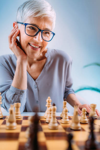 istock Cognitive Rehabilitation Activity. Senior Woman Playing Chess. 1325964351