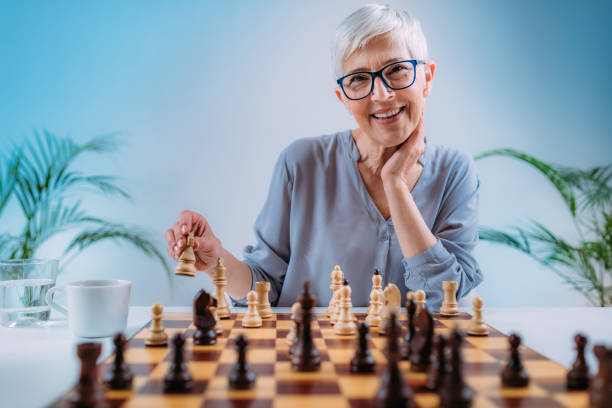 istock Cognitive Rehabilitation Activity. Senior Woman Playing Chess. 1325964473