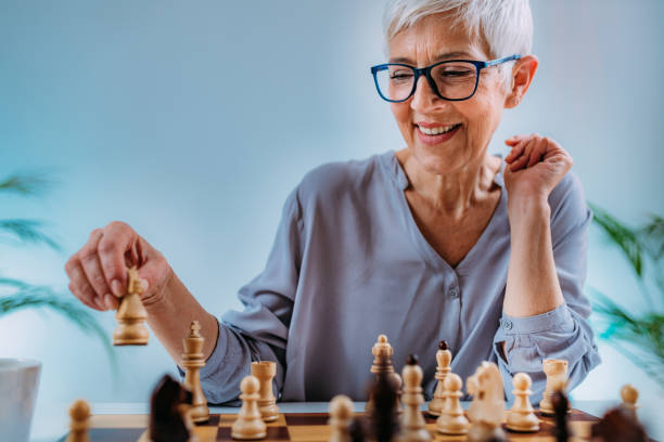istock Cognitive Rehabilitation Activity. Senior Woman Playing Chess. 1325964987