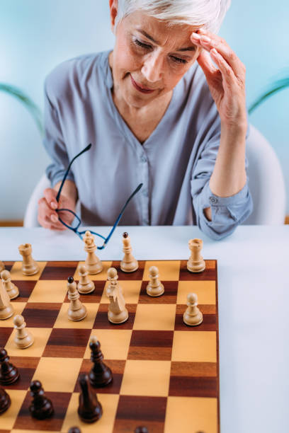 istock Cognitive Rehabilitation Activity. Senior Woman Playing Chess. 1325965014