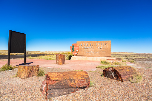 Navajo County, Arizona USA - October 19, 2016: The entrance sign to the Petrified Forest National Park, a popular tourist destination in northeastern Arizona.