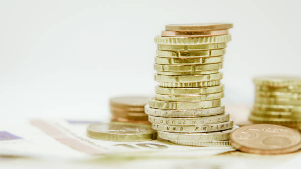 istock Euro bank notes and coins close view 1325968420
