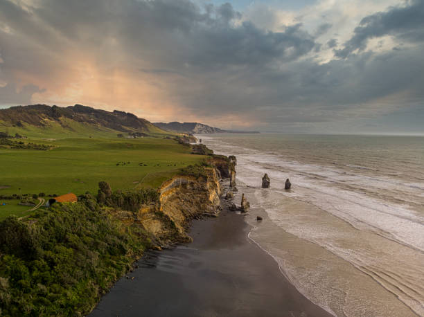 istock Panoramic view of cliffs by the beach. Famous rock formations named Three Sisters, located in New Plymouth, New Zealand 1325968848