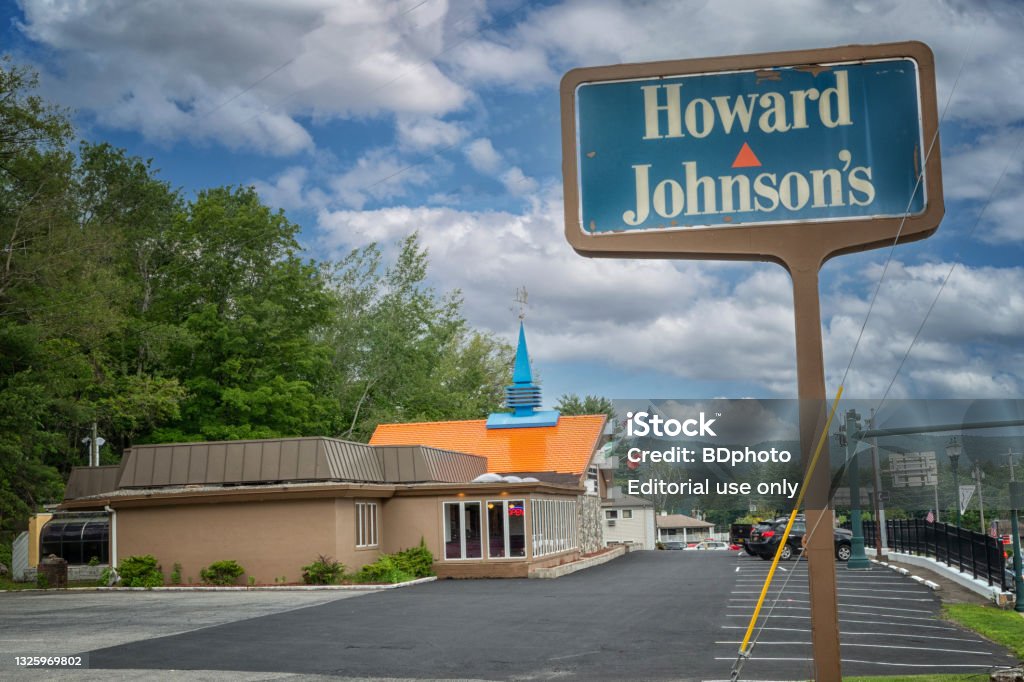 The last Howard Johnson's June 26, 2021 -  Lake George, NY USA- local residents and tourists alike visit the last standing Howard Johnson's restaurant in the world.   Once it was the largest restaurant chain in the U.S. throughout the 1960s and 1970s, with more than 1,000 combined company-owned and franchised outlets.  Now only one remains in operation/ Restaurant Stock Photo