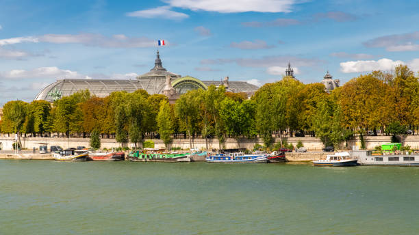 Paris, the Grand Palais, with houseboats on the Seine