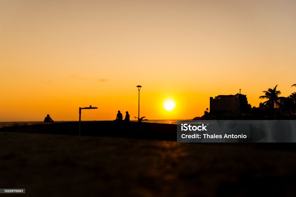 Late afternoon on the edge of Ondina beach. The edge of Ondina, Salvador beach, is one of the most beautiful in the city. It has a very beautiful sunset! Architecture Stock Photo