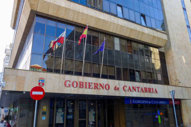 Gobierno de Cantabria government building in Santander. Spanish, Cantabrian and European flags waving stock photo