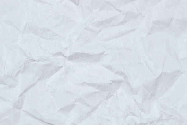 istock White crumpled wrapping paper texture background, top view 1325971996