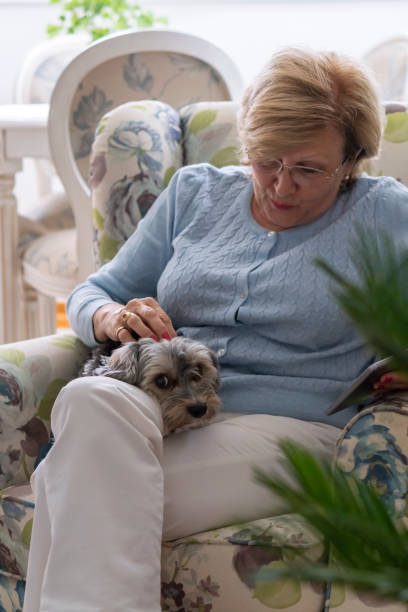 istock Senior woman with her little dog 1325974630