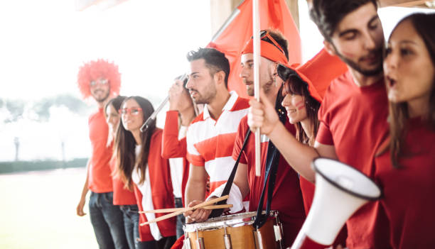 istock friends with blank sign at the stadium 1325977873