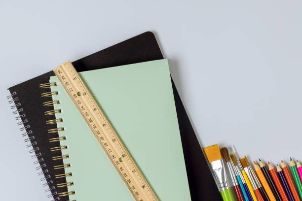 istock School supplies placed on a concept ready for school. 1325980422