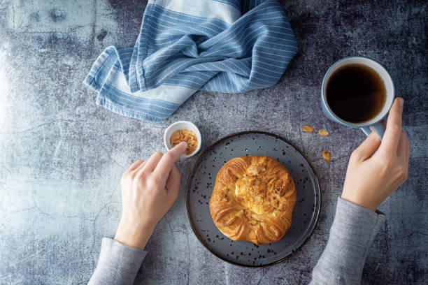 istock Vanilla cream almonds sweet bun in a plate 1325980573