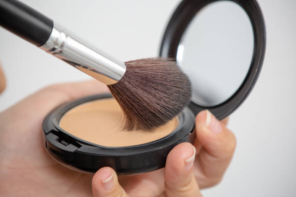 istock Makeup brush in various sizes with powder and illuminator. 1325981815